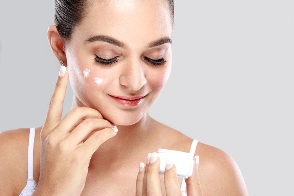 Skincare - Woman applying moisturiser